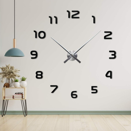 Zegar bezramkowy z centralnym mechanizmem i długimi wskazówkami. Zegar bezramkowy z centralnym mechanizmem i długimi wskazówkami.