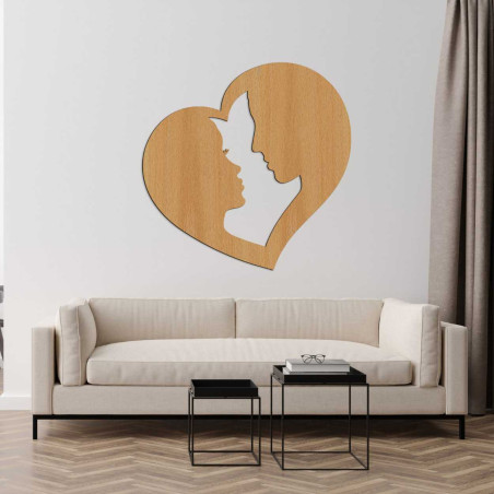 Profil mężczyzny i kobiety delikatnie wyrzeźbiony w ramce w kształcie serca, symbolizującej zjednoczenie. Profil mężczyzny i kobiety delikatnie wyrzeźbiony w ramce w kształcie serca, symbolizującej zjednoczenie.