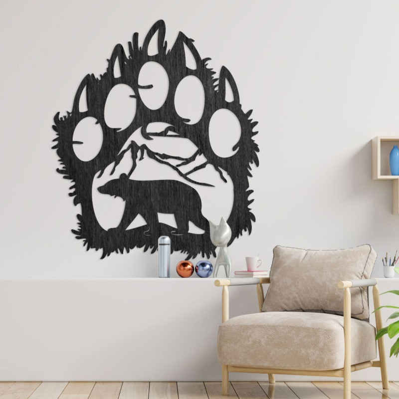 Czarny dekoracyjny motyw śladu niedźwiedzia z wyrzeźbionym niedźwiedziem i górskim otoczeniem - imponujący kontrast kształtów.